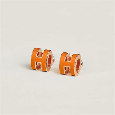 Pop h boucles d'oreilles Hermès Orange en Métal .